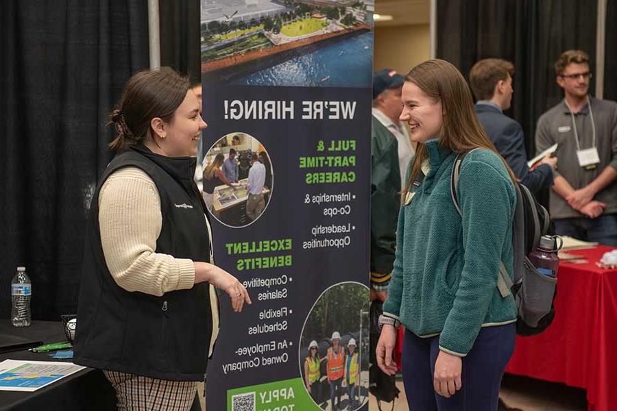 A student meeting with an employer at the career fair